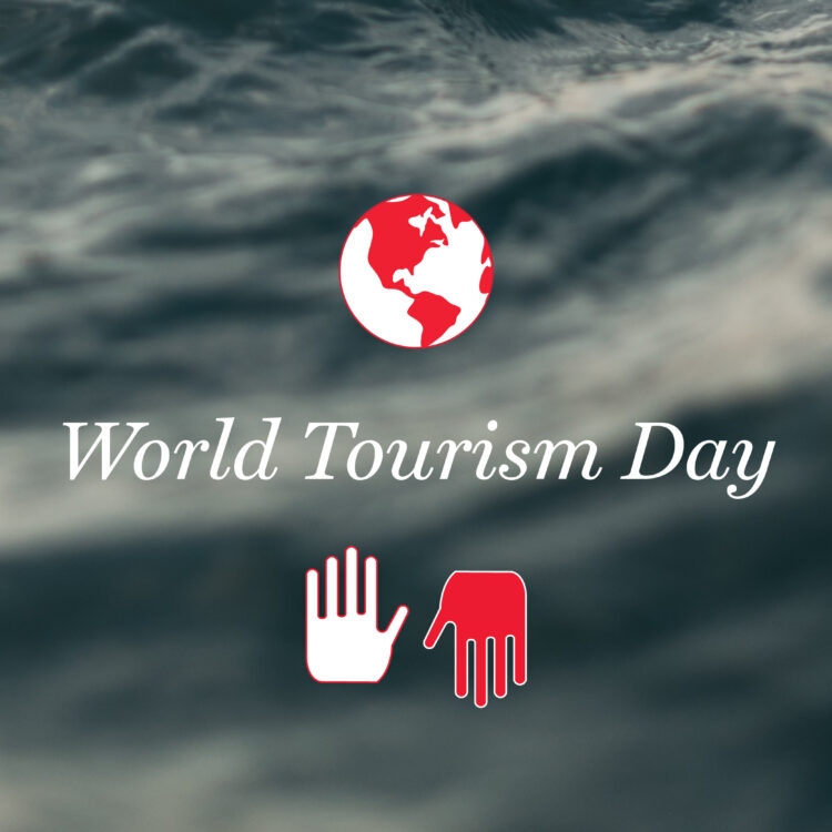 A globe and two hands, with the text "World Tourism Day" in front of a waving water